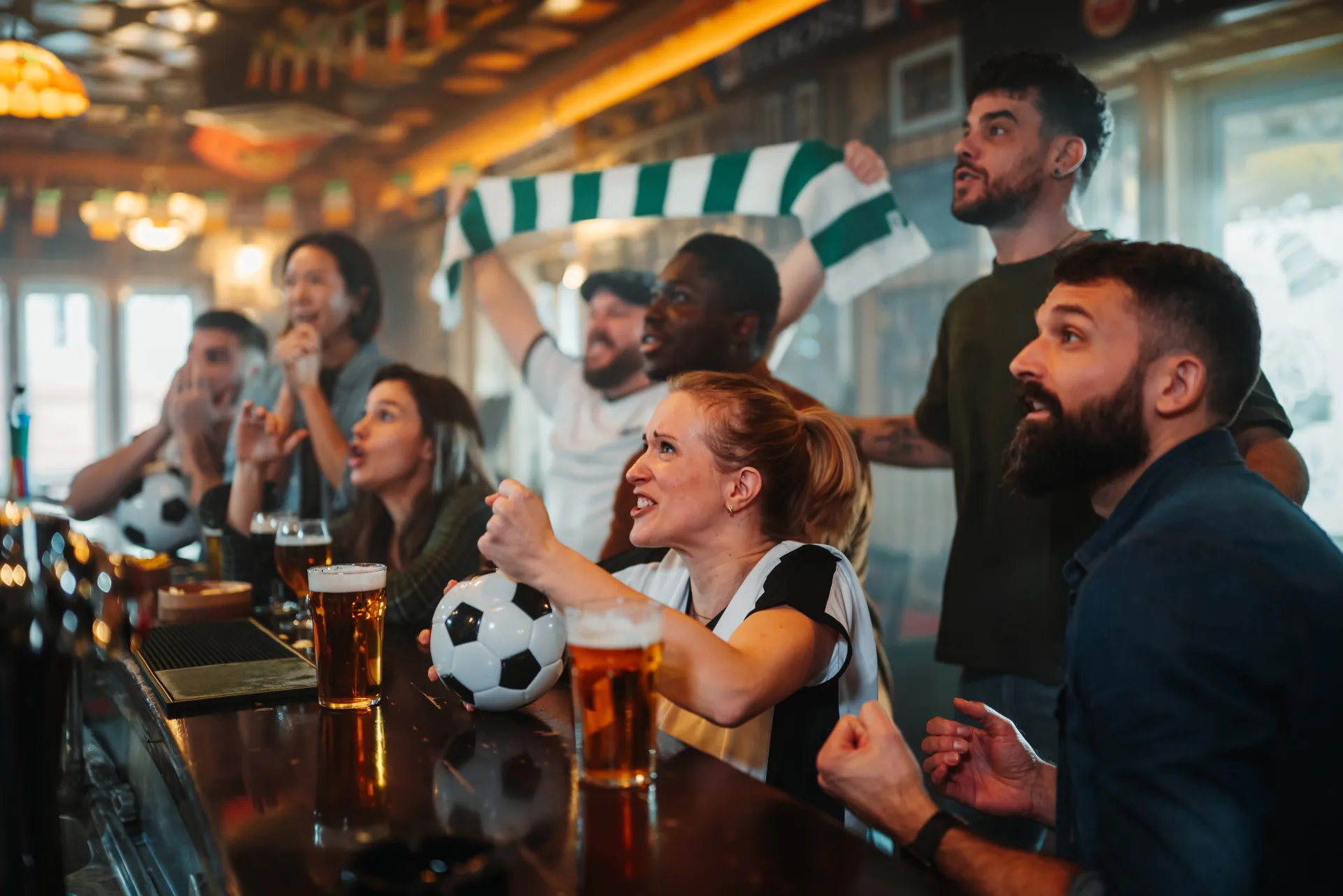 Soccer fans watching a match together at a local bar