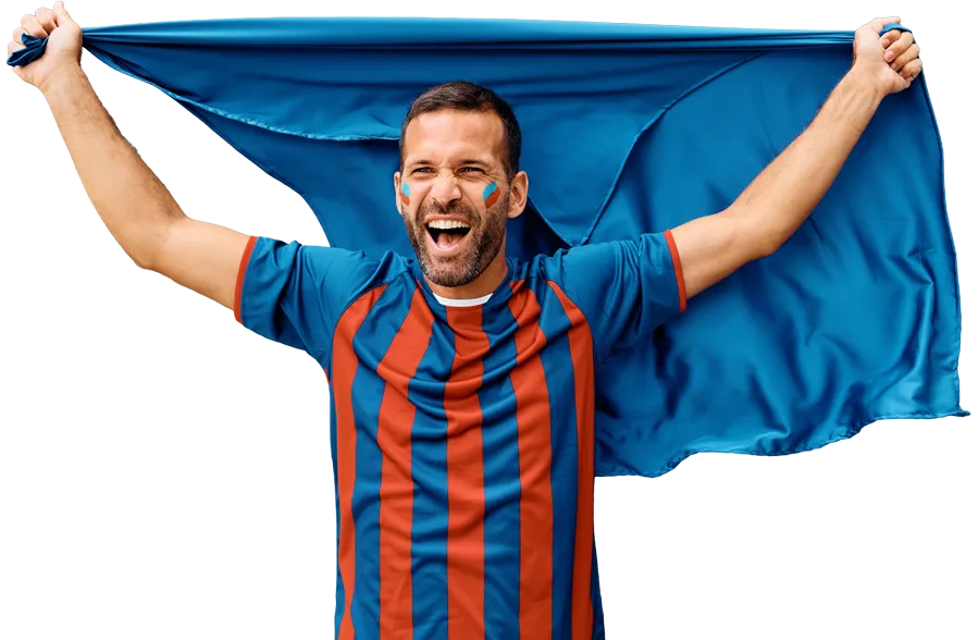 Soccer fan celebrating with a flag